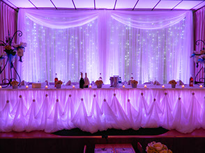 Wedding backdrop with LED Curtains and Purple uplighting